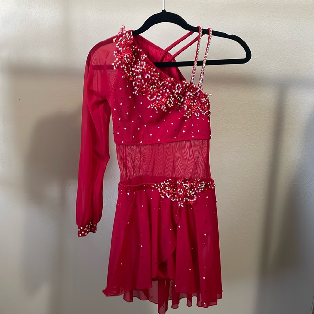 Dance costume with appliqués and rhinestones